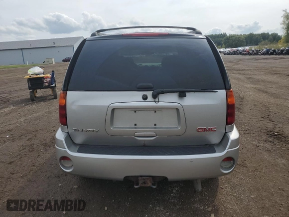 2007 GMC Envoy SLT with VIN 1GKDT13S272265100, listed as a Copart auction lot 73136264 with 245,198 mi miles and Salvage Title. Bid and sale history available at carsss.com. Image 6.