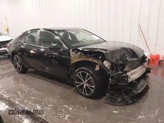 2019 Toyota Camry LE z VIN 4T1B11HK5KU279986, wystawiony jako IAAI lot #42277683 z przebiegiem 49 104 mil mil oraz . Historia ofert i sprzedaży dostępna na DreamBid. Obrazek 1.