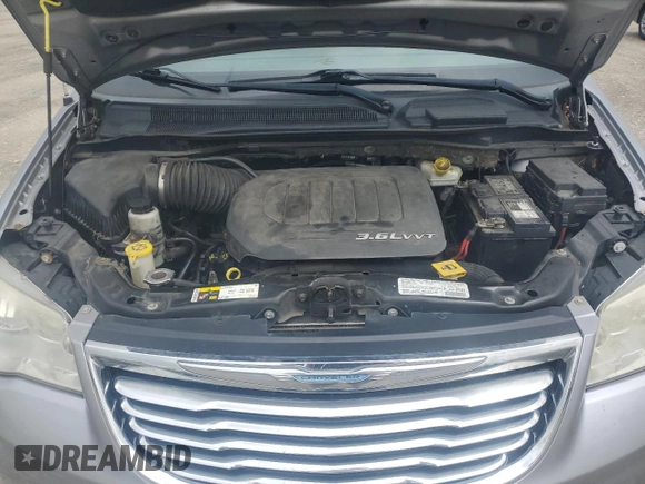 2013 Chrysler Town & Country Touring with VIN 2C4RC1BGXDR547903, listed as a Copart auction lot 56674585 with 140,214 mi miles and Salvage Title. Bid and sale history available at DreamBid. Image 12.