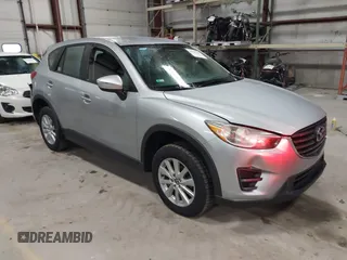 2016 Mazda CX-5 Sport with VIN JM3KE2BY2G0718434, listed as a IAAI auction lot 41961364 with 145,748 mi miles. Bid and sale history available at carsss.com. Image 1.
