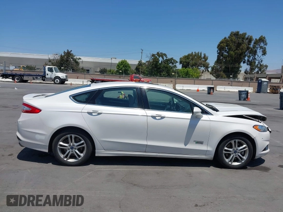 2016 Ford Fusion Titanium z VIN 3FA6P0SU1GR116118, wystawiony jako IAAI lot #42685489 z przebiegiem 138 690 mil mil oraz . Historia ofert i sprzedaży dostępna na DreamBid. Obrazek 13.