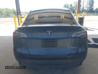 2023 Tesla Model Y Long Range with VIN 7SAYGAEE4PF906577, listed as a IAAI auction lot 42174987 with 13,260 mi miles and . Bid and sale history available at DreamBid. Image 16.