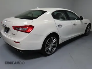 2014 Maserati Ghibli S Q4 z VIN ZAM57RTA7E1094580, wystawiony jako Copart lot #52009445 z przebiegiem 79 463 mil mil oraz Szkoda całkowita • Salvage title. Historia ofert i sprzedaży dostępna na DreamBid. Obrazek 3.