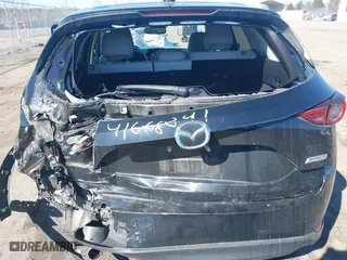 2019 Mazda CX-5 Grand Touring with VIN JM3KFBDM2K0603297, listed as a IAAI auction lot 41668241 with 54,583 mi miles. Bid and sale history available at carsss.com. Image 16.