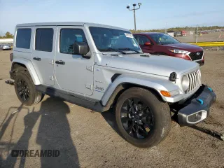 2024 Jeep Wrangler Sahara with VIN 1C4RJXP60RW128448, listed as a Copart auction lot 48658135 with 5,879 mi miles and Salvage Title. Bid and sale history available at DreamBid. Image 4.