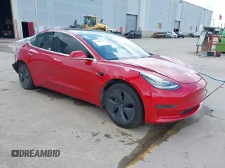 2020 Tesla Model 3 Standard Range Plus z VIN 5YJ3E1EA0LF611657, wystawiony jako IAAI lot #42046234 z przebiegiem 122 557 mil mil oraz . Historia ofert i sprzedaży dostępna na DreamBid. Obrazek 1.