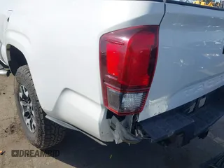 2018 Toyota Tacoma SR with VIN 5TFRX5GN9JX106232, listed as a IAAI auction lot 41634120 with 66,674 mi miles and . Bid and sale history available at DreamBid. Image 6.