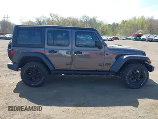 2021 Jeep Wrangler Unlimited Willys with VIN 1C4HJXDG1MW672507, listed as a IAAI auction lot 42084805 with 59,943 mi miles and . Bid and sale history available at DreamBid. Image 13.