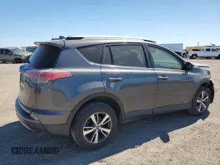 2018 Toyota RAV4 XLE with VIN JTMWFREV3JJ729302, listed as a Copart auction lot 49823765 with 100,576 mi miles and Salvage Title. Bid and sale history available at DreamBid. Image 3.