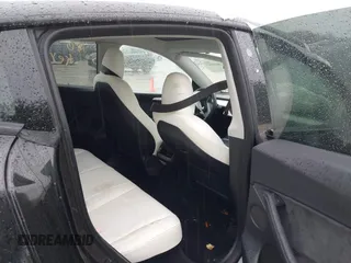 2023 Tesla Model Y Performance z VIN 7SAYGDEF0PF715703, wystawiony jako IAAI lot #41869780 z przebiegiem 32 220 mil mil oraz . Historia ofert i sprzedaży dostępna na DreamBid. Obrazek 8.
