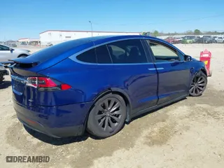 2017 Tesla Model X 90D with VIN 5YJXCBE26HF079022, listed as a IAAI auction lot 41847954 with 74,940 mi miles. Bid and sale history available at carsss.com. Image 4.