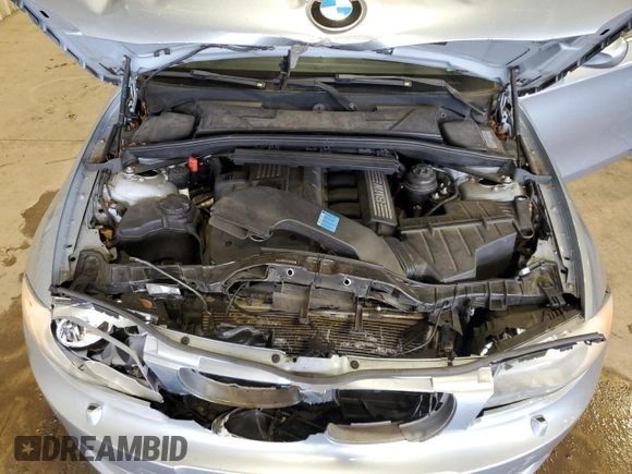 2011 BMW 1 Series 128i with VIN WBAUL7C57BVM80274, listed as a Copart auction lot 52127595 with 104,952 mi miles and Salvage title. Bid and sale history available at DreamBid. Image 11.