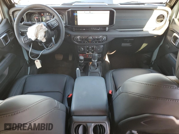 2024 Jeep Wrangler Rubicon z VIN 1C4RJXR64RW279791, wystawiony jako Copart lot #61348324 z przebiegiem 1 387 mil mil oraz Szkoda całkowita • Salvage title. Historia ofert i sprzedaży dostępna na DreamBid. Obrazek 8.