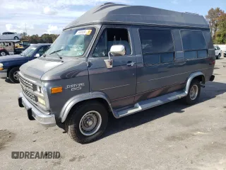 1994 Chevrolet Chevy Van z VIN 1GBEG25K5RF123489, wystawiony jako Copart lot #79491854 z przebiegiem 82 970 mil mil oraz Szkody całkowita. Historia ofert i sprzedaży dostępna na DreamBid. Obrazek 1.