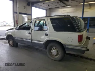 1996 GMC Jimmy SL with VIN 1GKDT13W4T2572197, listed as a Copart auction lot 76535534 with 157,624 mi miles and Salvage Title. Bid and sale history available at carsss.com. Image 2.