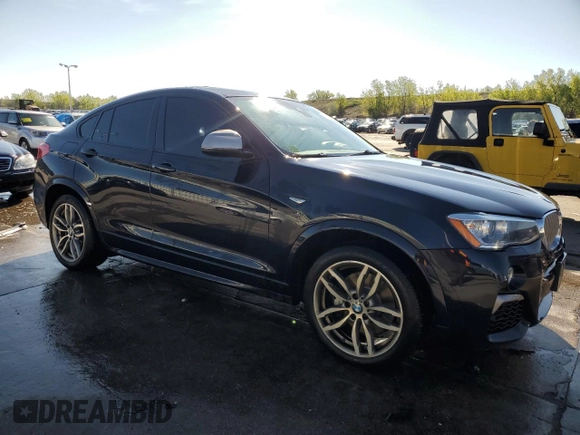 2018 BMW X4 M40i with VIN 5UXXW7C54J0Z44932, listed as a Copart auction lot 55973605 with 101,479 mi miles and Salvage title. Bid and sale history available at DreamBid. Image 4.