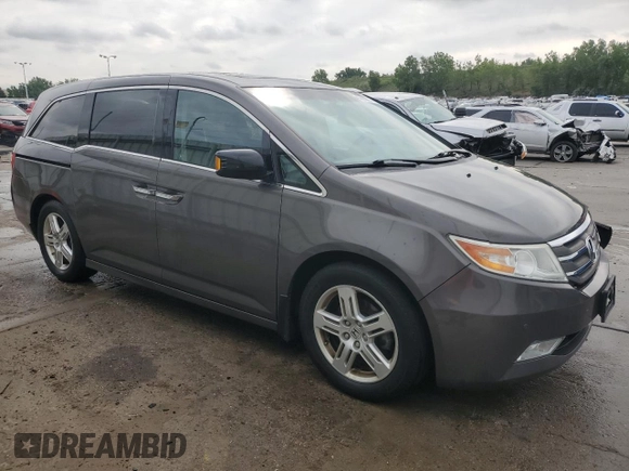 2012 Honda Odyssey Touring with VIN 5FNRL5H94CB109257, listed as a Copart auction lot 59636075 with 107,543 mi miles and Salvage title. Bid and sale history available at DreamBid. Image 4.