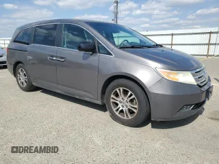 2011 Honda Odyssey EX-L with VIN 5FNRL5H61BB056652, listed as a Copart auction lot 54774015 with 233,125 mi miles and Salvage Title. Bid and sale history available at DreamBid. Image 4.
