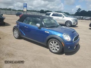 2015 MINI Convertible S with VIN WMWZP3C59F2A91231, listed as a Copart auction lot 59296415 with 31,642 mi miles and Salvage title. Bid and sale history available at DreamBid. Image 4.