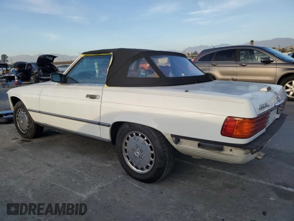 1989 Mercedes-Benz 560 Series 560SL with VIN WDBBA48D7KA100290, listed as a Copart auction lot 85049924 with 88,919 mi miles and Salvage Title. Bid and sale history available at carsss.com. Image 2.