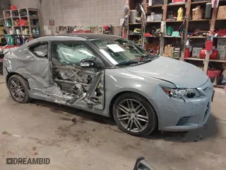 2011 Scion tC with VIN JTKJF5C75B3011028, listed as a IAAI auction lot 41556341 with 133,201 mi miles. Bid and sale history available at carsss.com. Image 1.