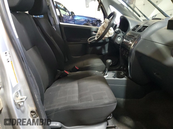 2010 Suzuki SX4 with VIN JS2YC5A49A6310256, listed as a Copart auction lot 73210584 with 135,021 mi miles and Salvage Title. Bid and sale history available at DreamBid. Image 7.