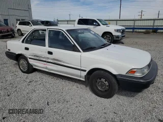 1990 Toyota Corolla z VIN 1NXAE94A0LZ089770, wystawiony jako Copart lot #75318334 z przebiegiem 161 894 mil mil oraz Szkoda całkowita • Salvage title. Historia ofert i sprzedaży dostępna na DreamBid. Obrazek 4.