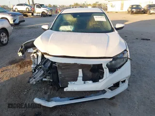 2019 Honda Civic LX with VIN 19XFC2F61KE014007, listed as a IAAI auction lot 41795070 with 64,259 mi miles and . Bid and sale history available at DreamBid. Image 6.