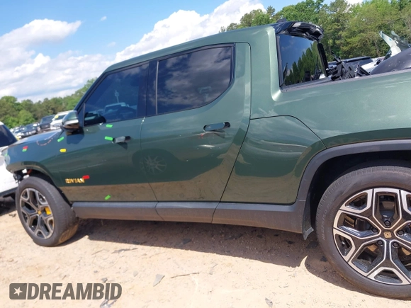 2023 Rivian R1T Adventure z VIN 7FCTGAAAXPN019894, wystawiony jako IAAI lot #42168226 z przebiegiem 23 380 mil mil oraz . Historia ofert i sprzedaży dostępna na DreamBid. Obrazek 15.