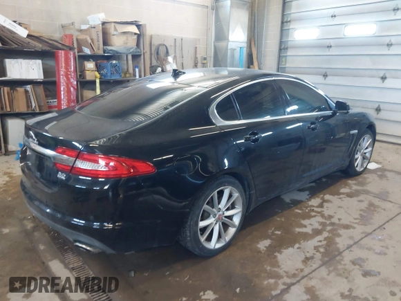 2015 Jaguar XF V6 Portfolio with VIN SAJWJ0FF5F8U57756, listed as a IAAI auction lot 41631278 with 47,158 mi miles. Bid and sale history available at carsss.com. Image 4.