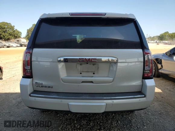 2020 GMC Yukon Denali with VIN 1GKS1CKJ6LR170901, listed as a Copart auction lot 76034594 with 118,738 mi miles and Salvage Title. Bid and sale history available at carsss.com. Image 6.