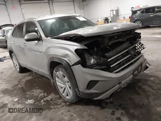 2021 Volkswagen Atlas SE z VIN 1V2HE2CA9MC219076, wystawiony jako IAAI lot #41608670 z przebiegiem 56 162 mil mil oraz . Historia ofert i sprzedaży dostępna na DreamBid. Obrazek 1.