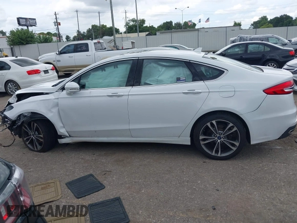 2020 Ford Fusion Titanium с VIN 3FA6P0D98LR151810, выставлен на аукционе IAAI как лот 42590902 с пробегом 76 624 миль миль и . История ставок и продаж доступна на DreamBid. Изображение 14.