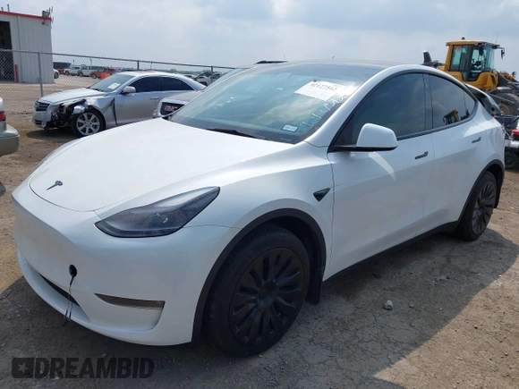 2023 Tesla Model Y Long Range with VIN 7SAYGAEEXPF776370, listed as a IAAI auction lot 42127512 with 27,120 mi miles and . Bid and sale history available at DreamBid. Image 2.