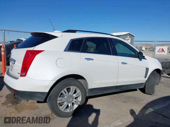 2015 Cadillac SRX with VIN 3GYFNAE34FS557297, listed as a IAAI auction lot 41388573 with 124,185 mi miles and . Bid and sale history available at DreamBid. Image 13.