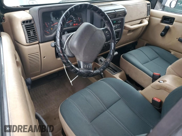 2002 Jeep Wrangler Sahara with VIN 1J4FA59S52P763290, listed as a Copart auction lot 59115665 with 129,479 mi miles and Non repairable. Bid and sale history available at DreamBid. Image 8.