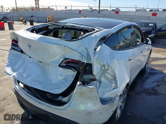 2021 Tesla Model Y Standard Range z VIN 5YJYGDED4MF162982, wystawiony jako IAAI lot #41378674 z przebiegiem 60 267 mil mil oraz . Historia ofert i sprzedaży dostępna na DreamBid. Obrazek 6.
