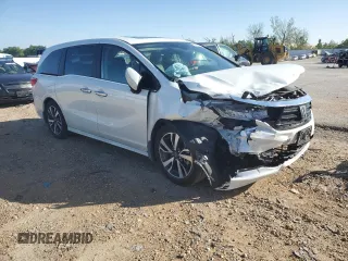 2021 Honda Odyssey Touring with VIN 5FNRL6H86MB003309, listed as a Copart auction lot 51648654 with 132,393 mi miles and Salvage Title. Bid and sale history available at carsss.com. Image 4.
