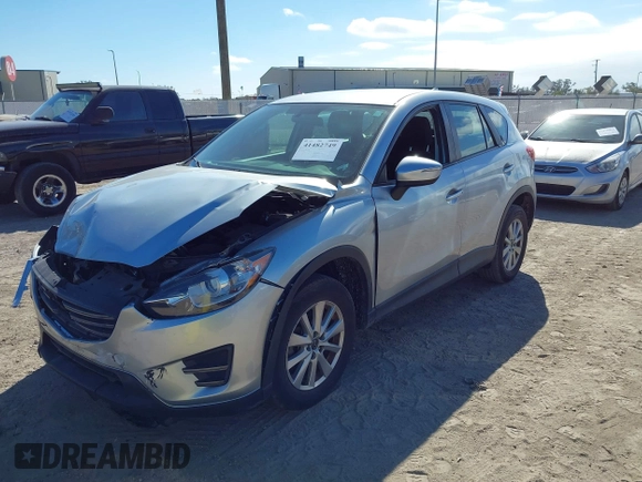 2016 Mazda CX-5 Sport with VIN JM3KE2BE9G0915168, listed as a IAAI auction lot 41482749 with 86,802 mi miles and . Bid and sale history available at carsss.com. Image 18.
