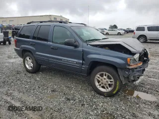 2004 Jeep Grand Cherokee Laredo with VIN 1J4GX48SX4C201569, listed as a Copart auction lot 58631585 with 271,124 mi miles and Salvage title. Bid and sale history available at DreamBid. Image 4.
