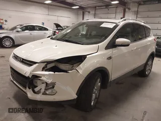 2014 Ford Escape Titanium with VIN 1FMCU9J9XEUE26857, listed as a IAAI auction lot 41552186 with 142,045 mi miles. Bid and sale history available at carsss.com. Image 2.