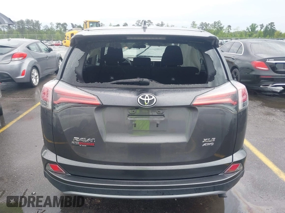 2018 Toyota RAV4 XLE with VIN 2T3RFREV5JW701564, listed as a IAAI auction lot 41976067 with 128,404 mi miles. Bid and sale history available at carsss.com. Image 16.