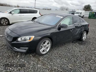 2015 Volvo S60 T5 Drive-E Premier with VIN YV140MFKXF2354360, listed as a Copart auction lot 43942955 with 56,982 mi miles and Salvage Title. Bid and sale history available at carsss.com. Image 1.