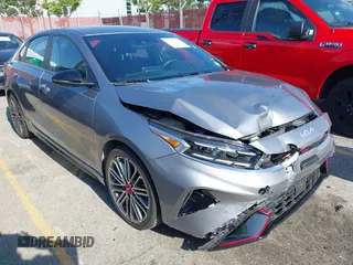 2024 Kia Forte GT z VIN 3KPF44AC7RE802984, wystawiony jako IAAI lot #42147389 z przebiegiem 7018 mil mil oraz . Historia ofert i sprzedaży dostępna na DreamBid. Obrazek 1.