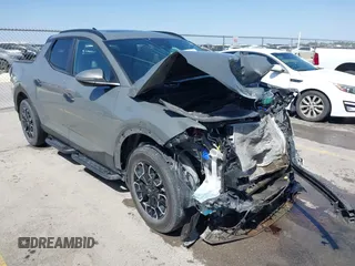 2023 Hyundai Santa Cruz SEL z VIN 5NTJCDAE0PH061456, wystawiony jako IAAI lot #41857907 z przebiegiem 25 449 mil mil oraz . Historia ofert i sprzedaży dostępna na DreamBid. Obrazek 1.