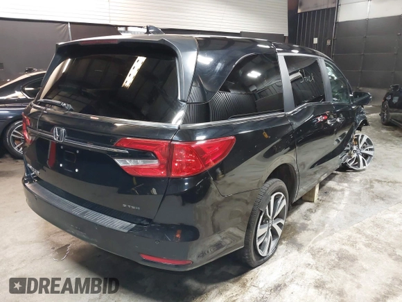 2021 Honda Odyssey Touring with VIN 5FNRL6H83MB040138, listed as a IAAI auction lot 39150096 with 61,322 mi miles and . Bid and sale history available at DreamBid. Image 4.