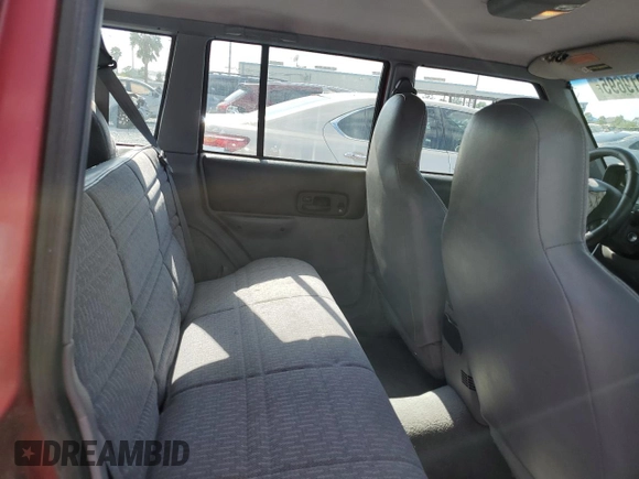 1998 Jeep Cherokee Sport with VIN 1J4FT68S4WL270134, listed as a Copart auction lot 51019695 with 246,945 mi miles and Non Repairable. Bid and sale history available at carsss.com. Image 10.