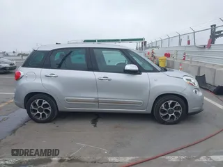 2014 FIAT 500L Lounge z VIN ZFBCFACH8EZ005035, wystawiony jako IAAI lot #41824368 z przebiegiem 80 914 mil mil oraz . Historia ofert i sprzedaży dostępna na DreamBid. Obrazek 13.
