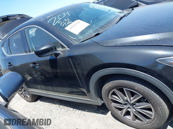 2018 Mazda CX-5 Grand Touring with VIN JM3KFADM4J0326760, listed as a IAAI auction lot 41885100 with 82,091 mi miles and . Bid and sale history available at DreamBid. Image 13.