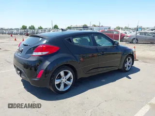 2013 Hyundai Veloster w/Black Int with VIN KMHTC6AD2DU144376, listed as a IAAI auction lot 42720882 with 143,023 mi miles and . Bid and sale history available at DreamBid. Image 4.
